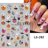 Halloween nails with 5D embossed stickers featuring ghost, pumpkin, and skull designs.