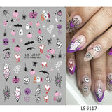 Halloween nails with 5D embossed stickers featuring ghost, pumpkin, and skull art.