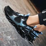 Men's breathable black and blue mesh sneakers with lace-up closure on pavement.