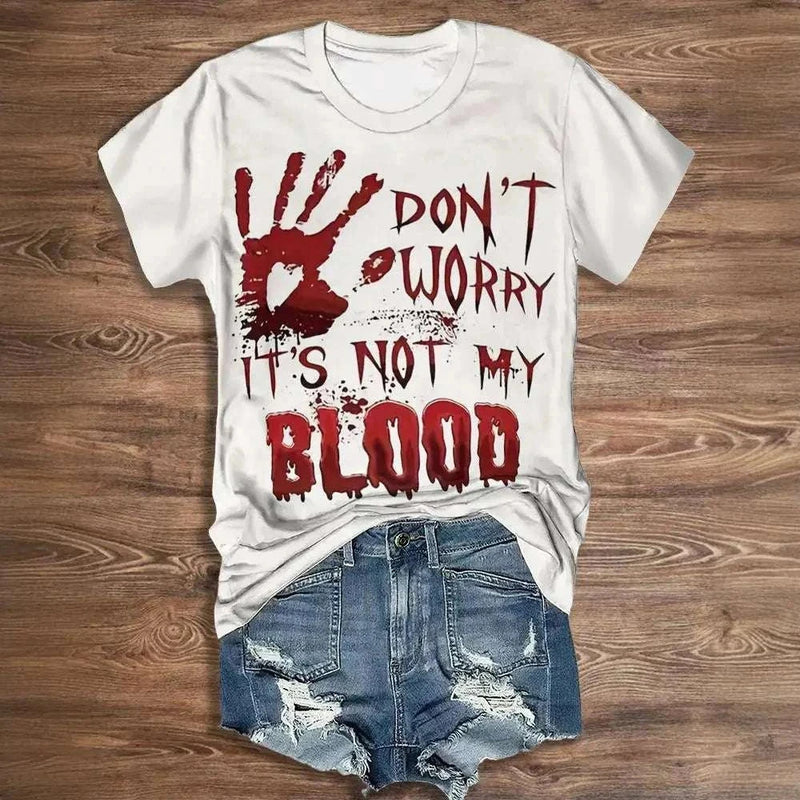 Vintage letter print women's Halloween shirt with "Don't Worry It's Not My Blood" design, paired with distressed denim shorts.